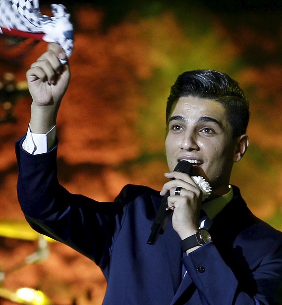 Mohammed Assaf, UNRWA Regional Youth Ambassador and Winner of Arab Idol 2013, performs during the 51st edition of the International Festival of Carthage at the Roman Theatre of Carthage in Tunis